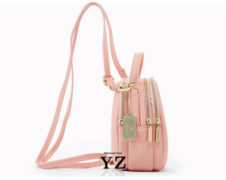 Bold and elegant, the soft blue macaron is one of our favorites. Made with soft, smooth faux-leather, it features a modern, versatile design that styles up any outfit with effortless elegance. The luxurious golden zippers and tags create a stunning accent against the classy bluee body. Spacious and practical in its design, this cross-body strapped shoulder bag is perfect for carrying your essentials as you head out for an evening filled with fun, excitement, and adventure.