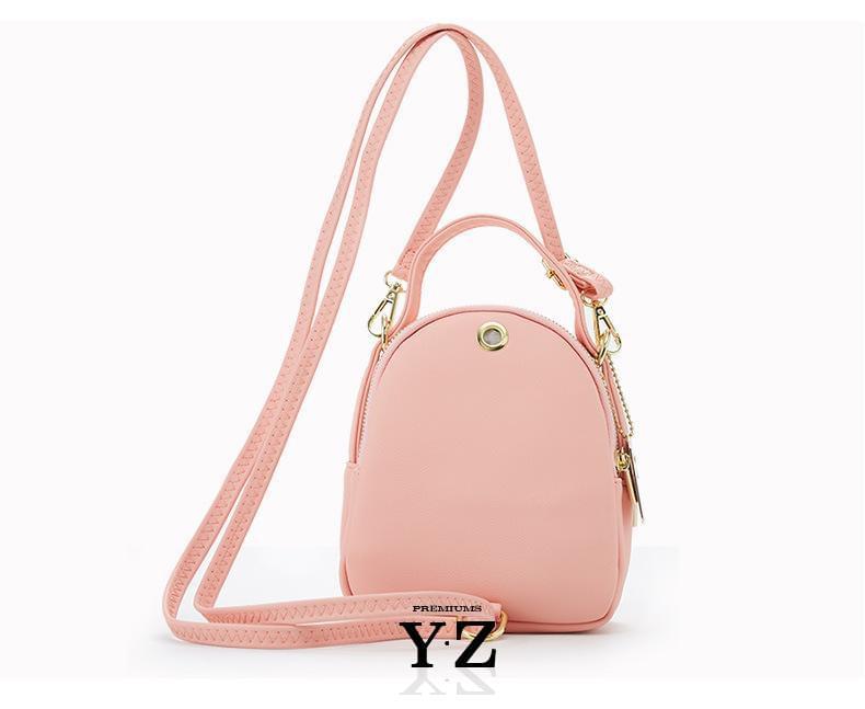 Bold and elegant, the green macaron is one of our favorites. Made with soft, smooth faux-leather, it features a modern, versatile design that styles up any outfit with effortless elegance. The luxurious golden zippers and tags create a stunning accent against the classy green body. Spacious and practical in its design, this cross-body strapped shoulder bag is perfect for carrying your essentials as you head out for an evening filled with fun, excitement, and adventure.