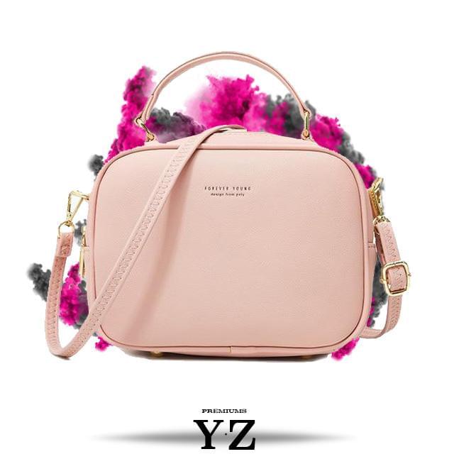 The Signature Handbag has four points in the bottom that ensure a well-balanced bag when not holding the bag. Gold-colored zippers create a shiny style hidden in the details. With a font "Young Forever" with the same color tone as the zippers, gives us the message that stylish Signature handbag is adaptable regardless of age and experience. Inside, we find two equally large pockets in the handbag that offer very good space for everything one would need for an important and charming occasion.